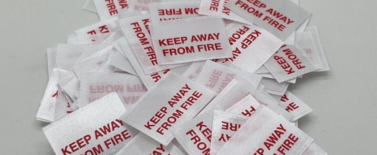 “KEEP AWAY FROM FIRE” clothing label – what it means on kids’ garments